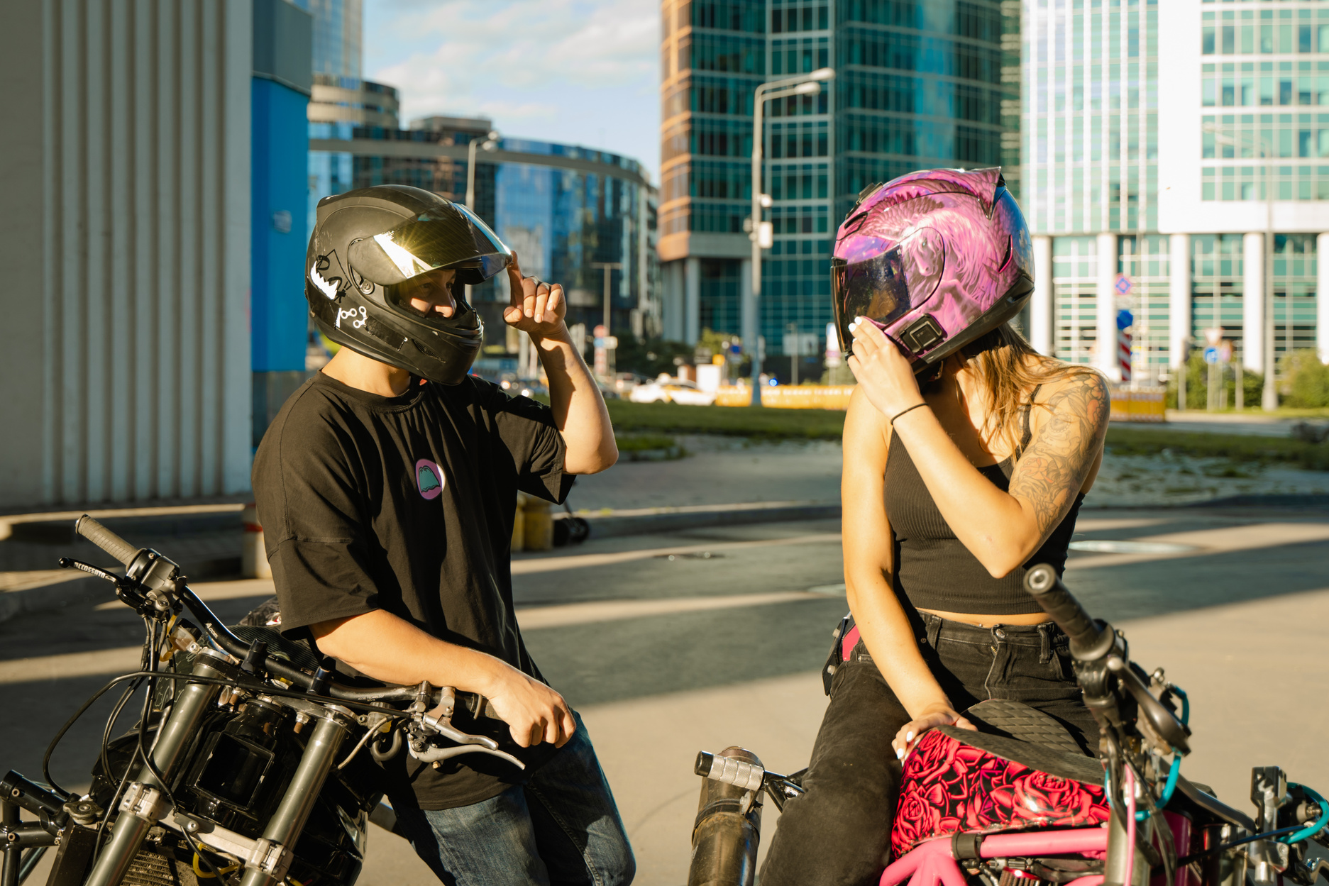 Man and Woman On Motorcycles with Helmets